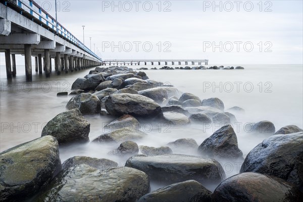 Coastal rocks with pier