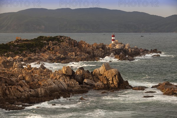 Rocky coast with lighthouse at Ganh Dia