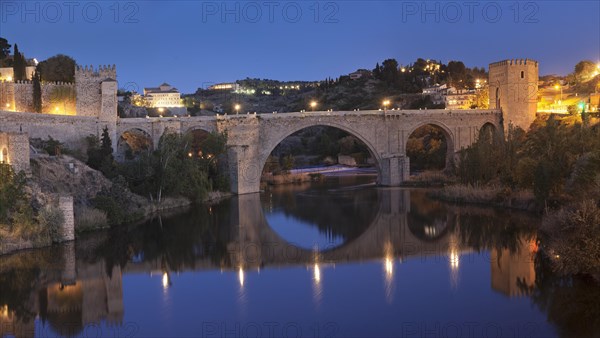 Puente de San Martin bridge reflected in the Tajo River