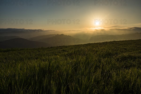 Hilly landscape at sunrise