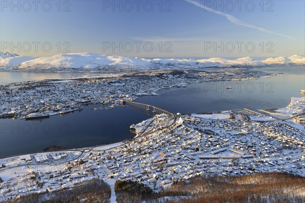 Snowy town with bridge