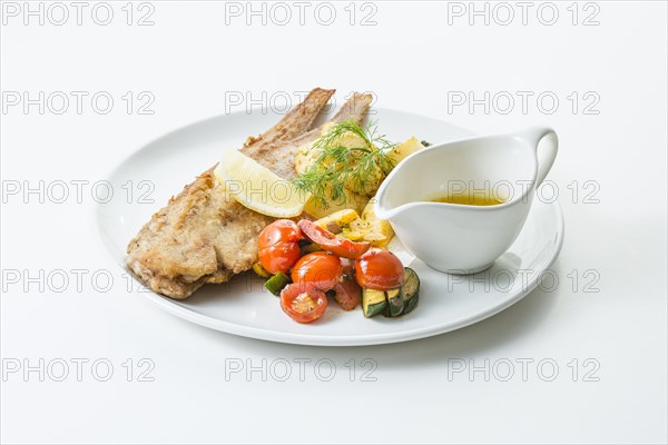 Fried floured sole with parsley potatoes and buttered vegetables