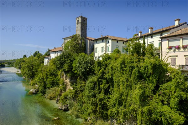 View over the river Natisone to the Campanile of the cathedral Santa Maria Assunta and the old town