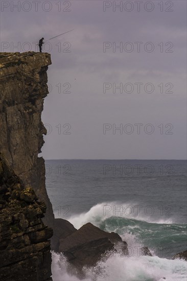 Clifffisher at steep coast