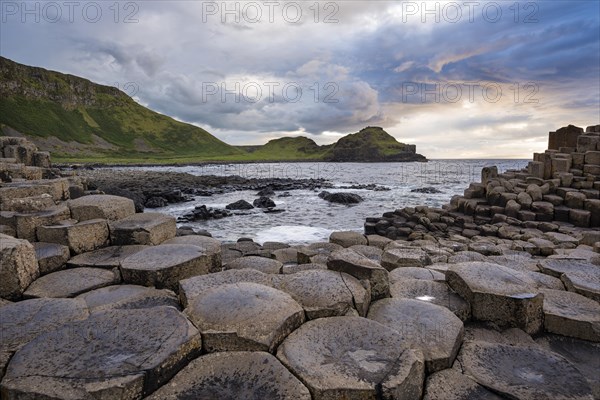 Basalt columns by the coast at sunset