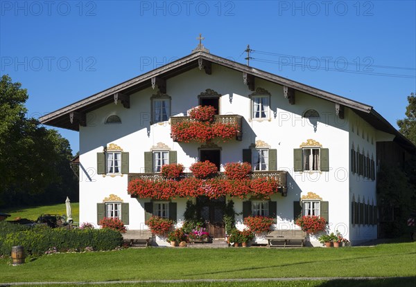 Farmhouse with balcony flowers