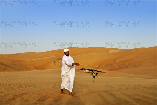 Falconer in the desert luxury hotel Anantara Qasr Al Sarab