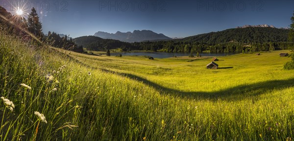 Small cabins on mountain meadow