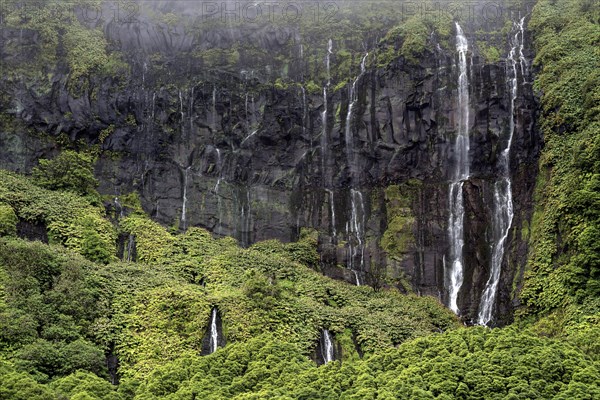 Waterfalls over lava rocks