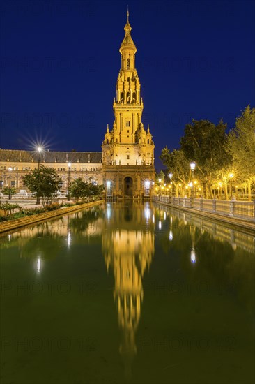 Tower reflected in water basin