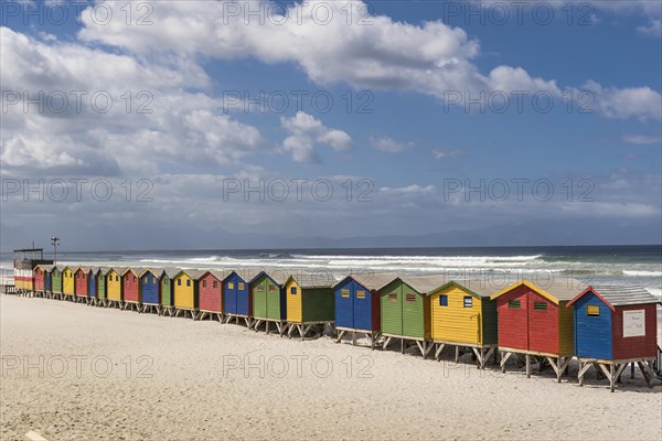 Colorful beach houses with cloudy sky