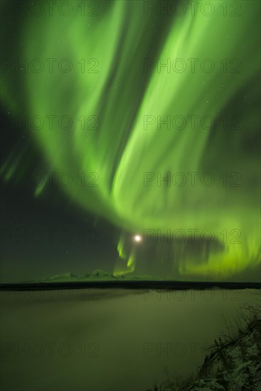 Aurora over the Copper River and the distant peaks of Wrangell Mountains