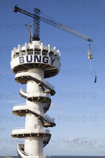 Bungy jump tower with bungy jumper