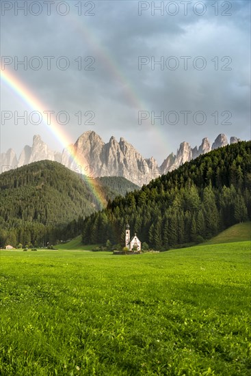 Rainbow in front of the church St. Johann in Ranui