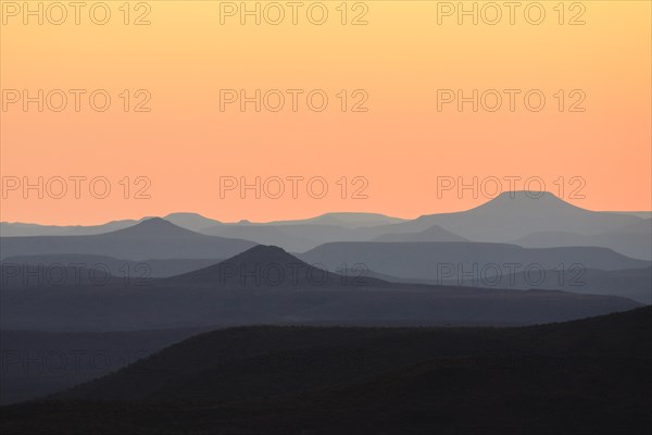 Staggered mountains at sunset