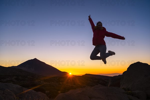 Young woman jumping in the air