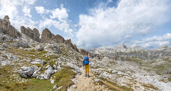 Hikers on the circular trail around the Sella Group