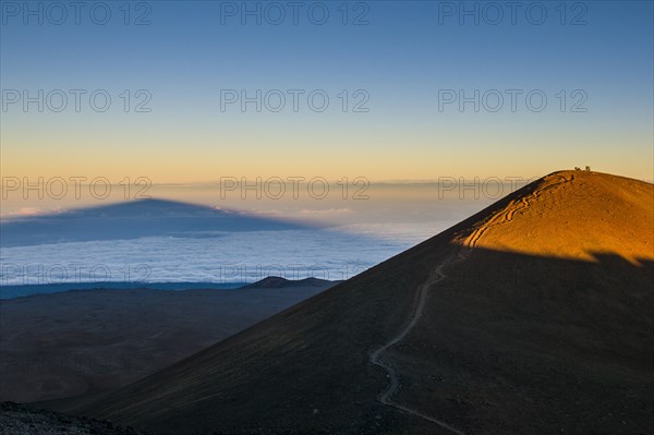 Mauna Kea in evening light casts a shadow
