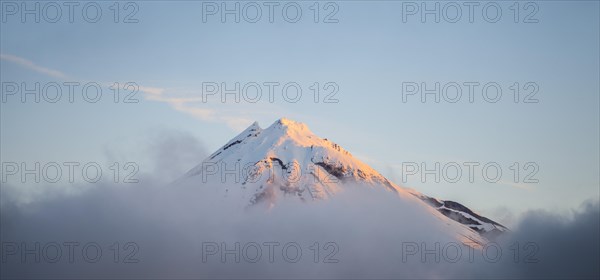 Stratovolcano Mount Taranaki or Mount Egmont at sunset