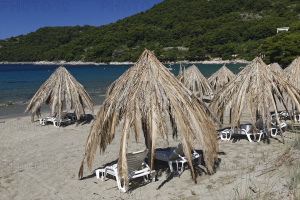 Sunshades at the sand beach at Saplunara