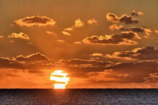 Sunset with cloudy sky above the North Sea