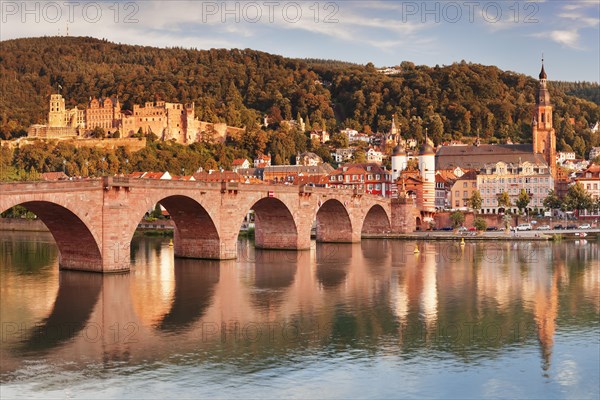 View of Karl Theodor Bridge and Gate over the Neckar River with castle in Heidelberg
