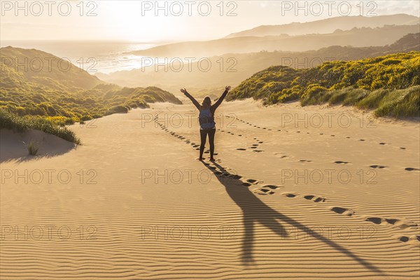 Woman raising arms in the air