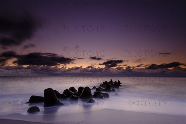 Concrete blocks as coastal protection on the beach of Hornum in the evening light