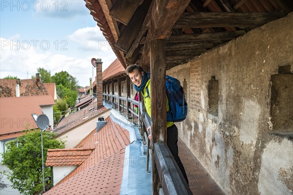 Young man on the old city wall