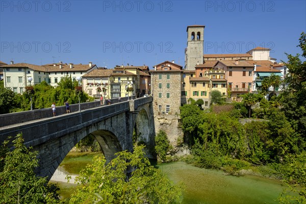 View over the river Natisone to the Campanile of the cathedral Santa Maria Assunta and the old town
