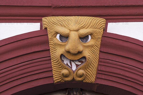 Grotesque above a gate entrance of an old farmstead from 1733