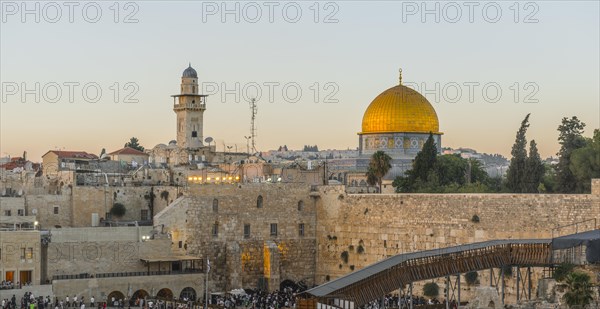 Believers at the Wailing Wall at dusk