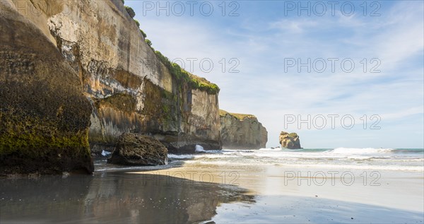 Sandstone rocks towering into the sea