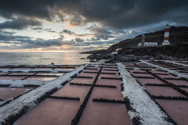 Salinas of Fuencaliente with lighthouse Faro de Fuencaliente at sunset