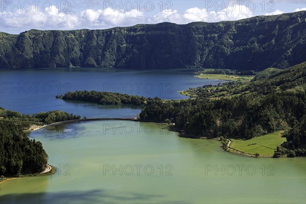 View from Miradouro da Vista do Rei into the volcanic crater Caldera Sete Cidades with the crater lakes Lagoa Verde and Lago Azul