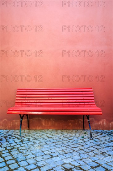 Red bench and red wall