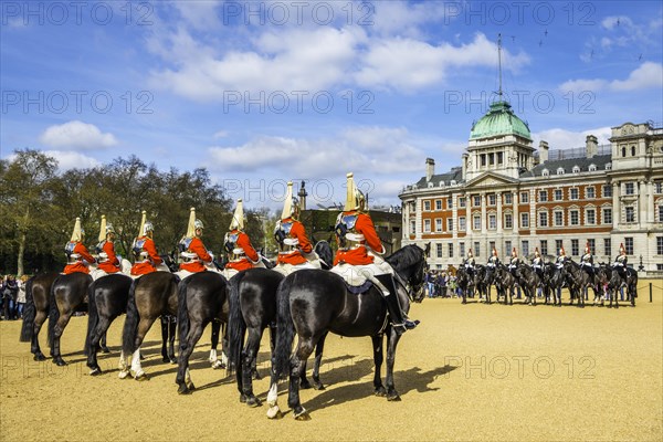 Royal Guards in red uniform on horses