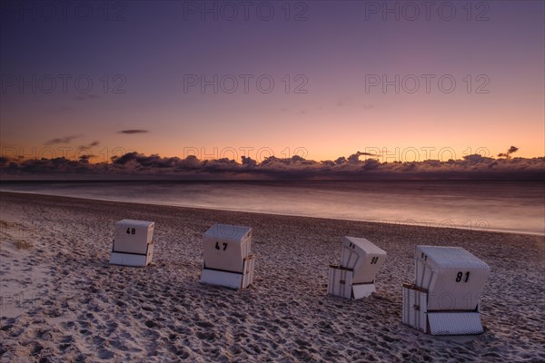 Beach chairs at the west beach of Hornum in the evening light