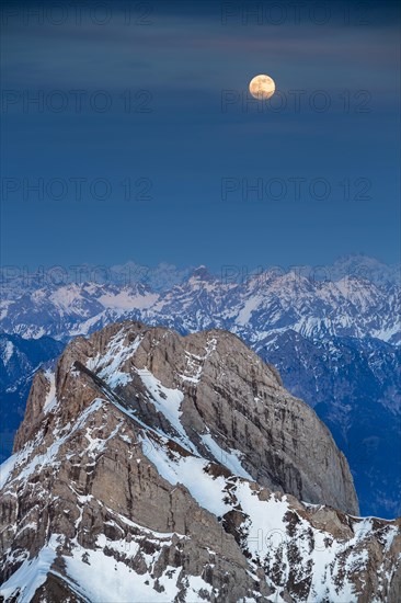 Santis Mountain overlooking Alpstein massif at full moon