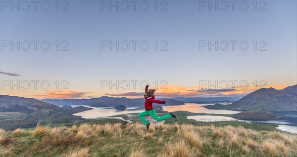 Hiker jumping in the air