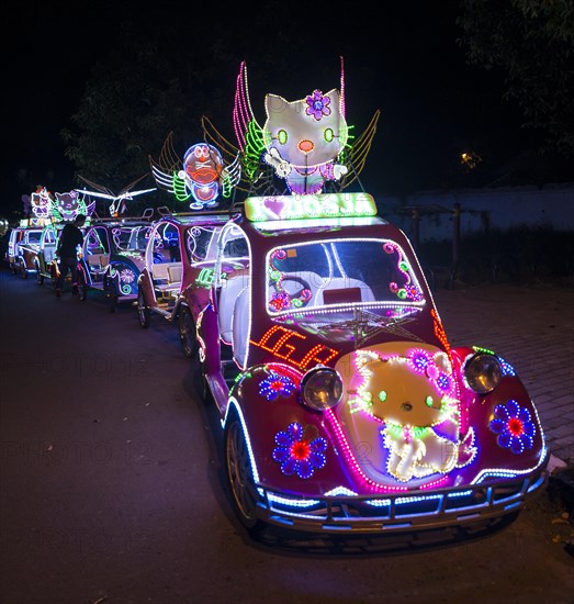 Colorful with LEDs illuminated cars