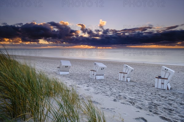 Beach chairs at the west beach of Hornum in the evening light