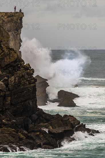 Cliff fisher at steep coast