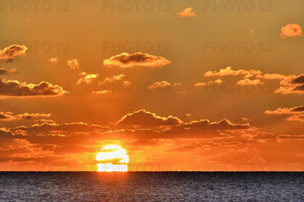 Sunset with cloudy sky above the North Sea