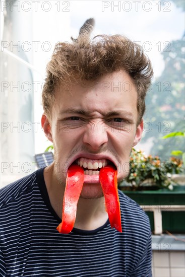 Young man looking grimly in the camera