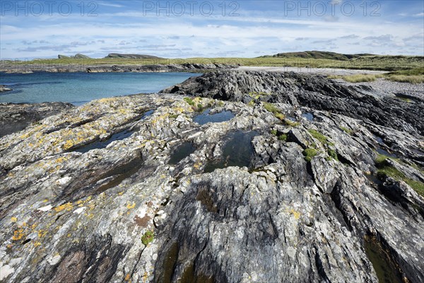 Rugged Slate rocks in the Bay of Saligo