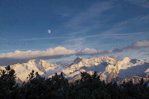 Snowy Zillertal Alps with moon in winter