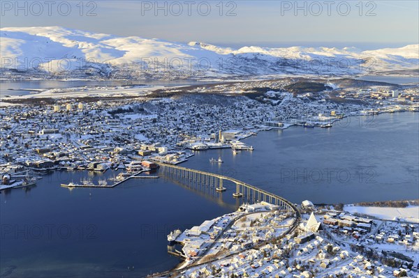 Snowy town with bridge