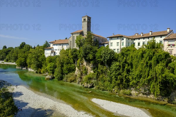 View over the river Natisone to the Campanile of the cathedral Santa Maria Assunta and the old town