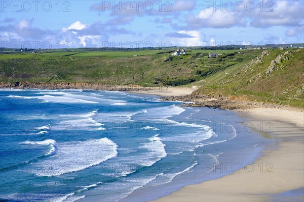 Wide sandy beach with waves